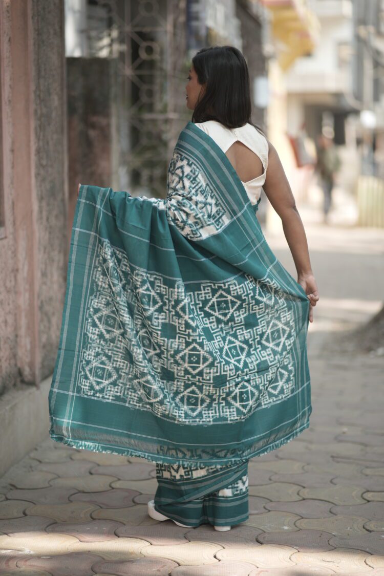 Handwoven Green Telia Rumal saree showcasing double ikat geometric motifs