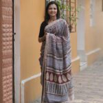 Maroon, blue, and black horizontal striped Maheshwari saree with traditional Bagh hand-block printed borders.