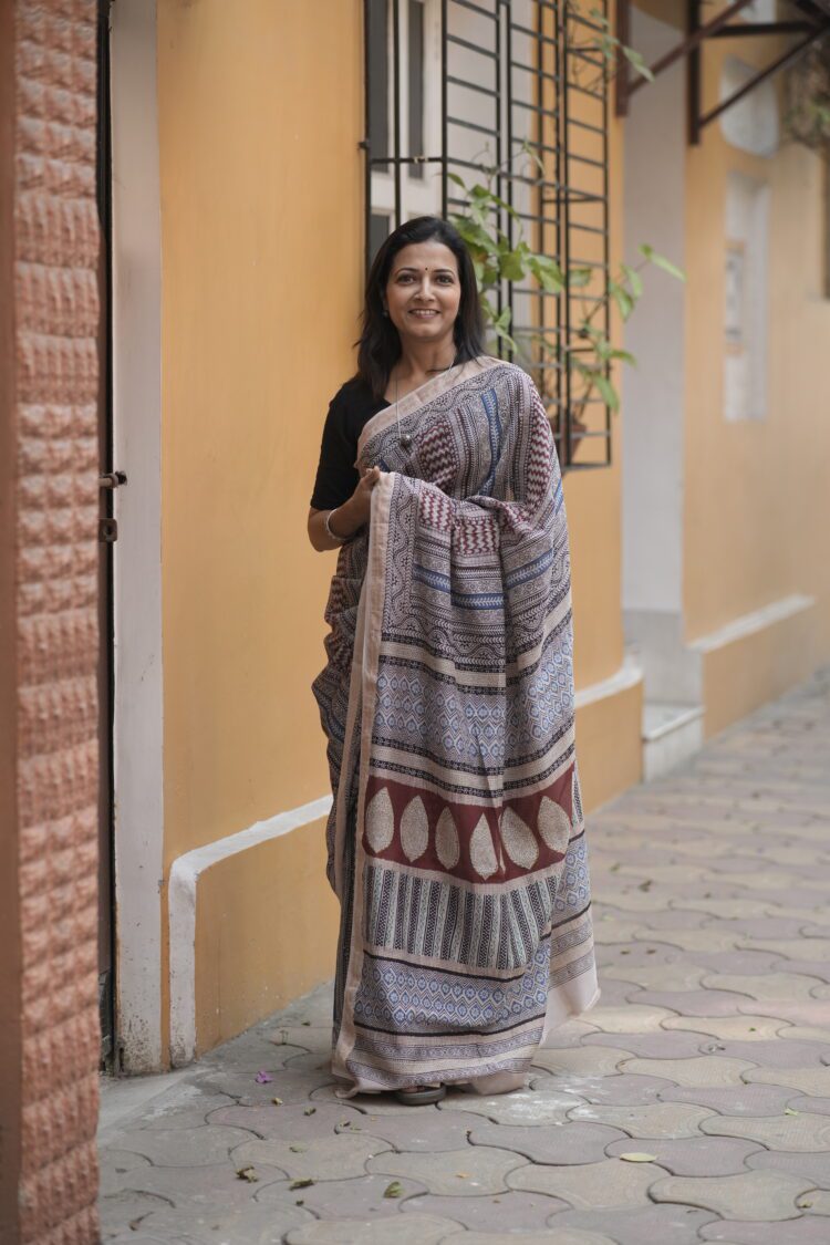 Maroon, blue, and black horizontal striped Maheshwari saree with traditional Bagh hand-block printed borders.