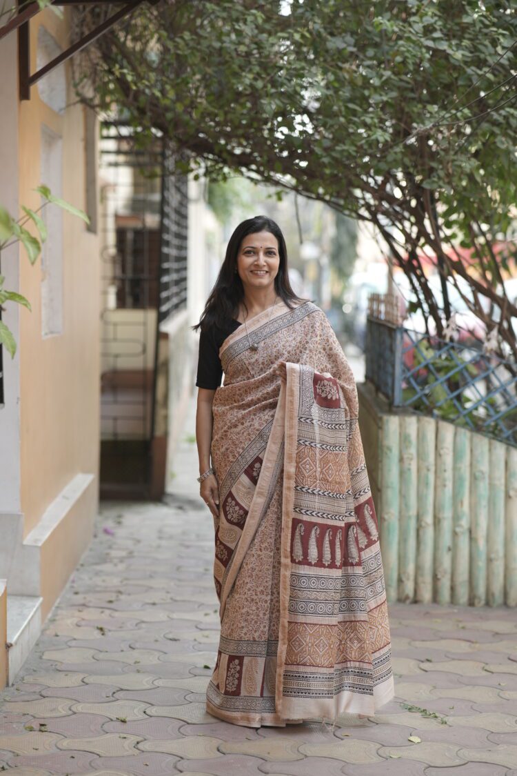 Beige Maheshwari saree featuring an all-over Chrome Yellow and Maroon floral Jal Bagh hand-block print.