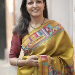 Artisan-made chrome yellow saree featuring traditional Kantha stitch work