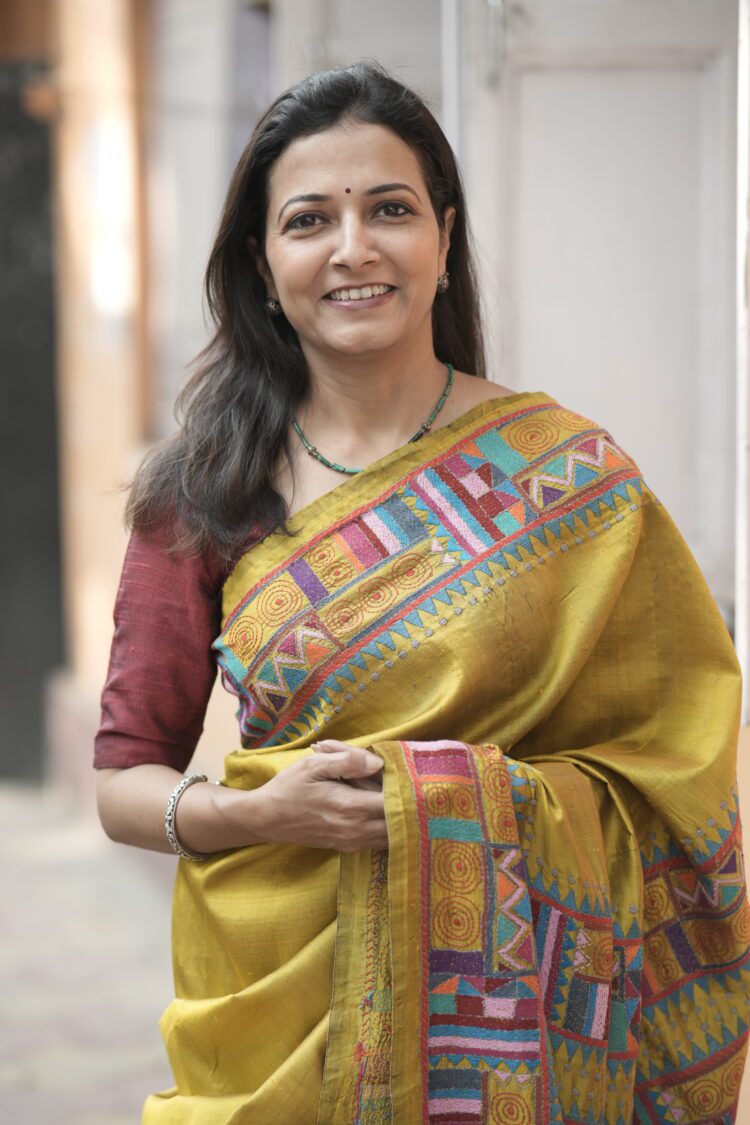 Artisan-made chrome yellow saree featuring traditional Kantha stitch work