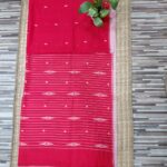 Handwoven red Jamdani saree featuring delicate small buta design