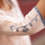 Peach handwoven Jamdani cotton top with delicate woven motifs