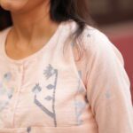 Close-up of Jamdani weaving on peach cotton top